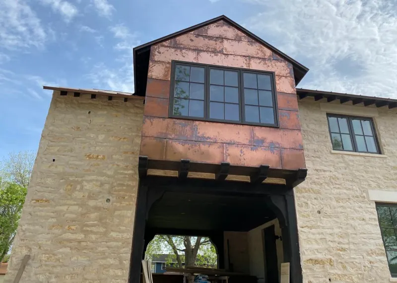 Copper metal panel facade on a stone building for Skylight Installation in Thurmont